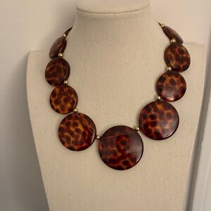 Joan Rivers Signed Graduated Tortoise Shell Necklace with Gold Tone Spacers.